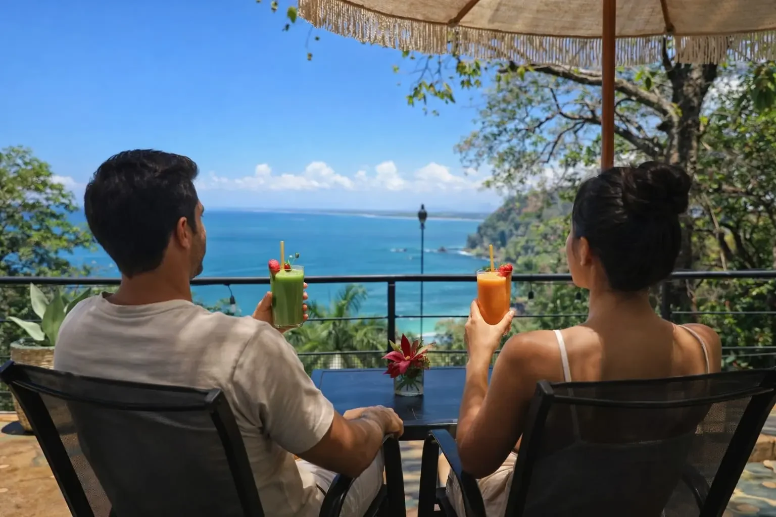 Guests enjoying drinks with Pacific Ocean views at Hotel VOS in Manuel Antonio Costa Rica