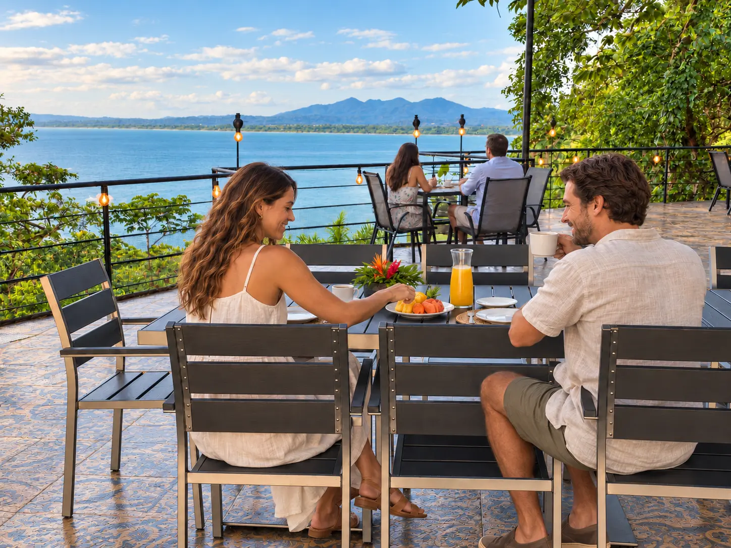 Couple dining on the Hotel VOS rooftop overlooking the Pacific Ocean