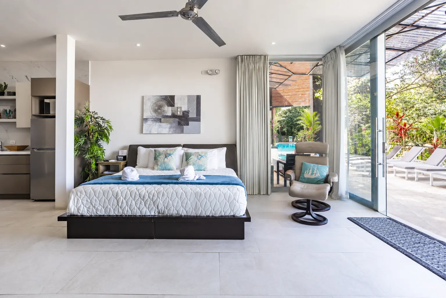 Suite 1 pool-level room and outdoor access at Hotel VOS