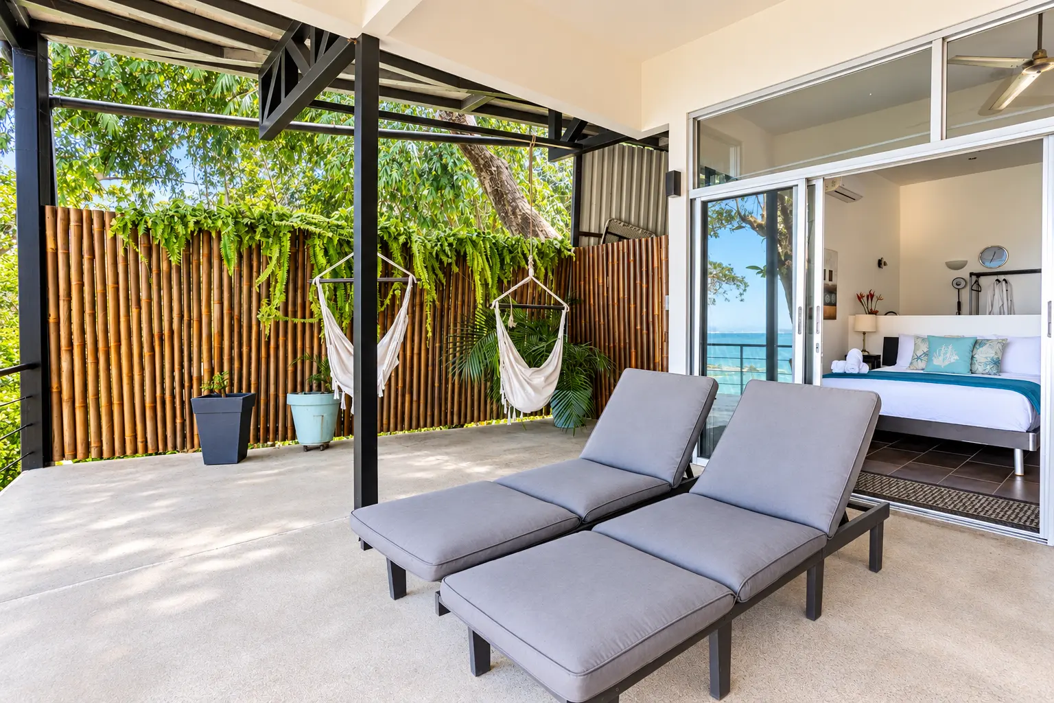 Suite 5 private terrace with loungers and tropical privacy
